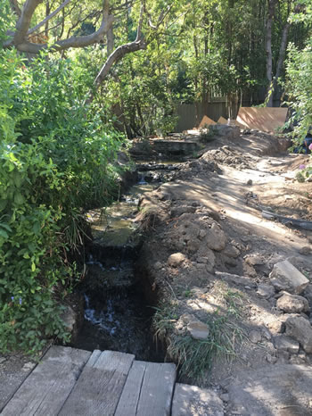 Earlier unsuccessful attempts left this dried up stream bed.
