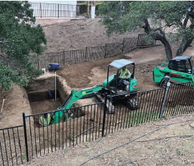 Other picture of the team completes the
excavation of the large pondless basin-rainwater capture system.